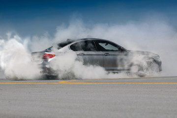 Modern car burnout. Auto make tire smoke and drift