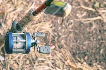 Spinning rod with baitcasting reel and bait