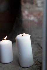 Two candles on a background of cobwebs
