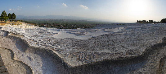 Turkey, aerial view of the travertine terraces at Pamukkale (Cotton Castle), natural site of sedimentary rock deposited by water from hot springs, famous for carbonate mineral left by flowing water