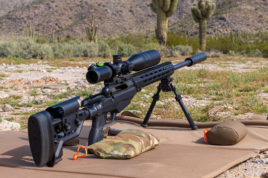Suppressed Precision bolt action rifle at outdoor shooting range