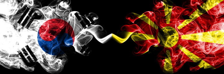 South Korea vs Macedonia, Macedonian smoky mystic flags placed side by side. Thick colored silky abstract smoke flags of South Korean and Macedonia, Macedonian