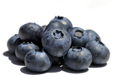Blueberry on white background. A pile of fresh blueberries, close-up