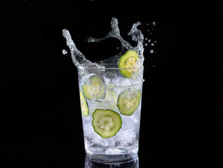 Cucumber water on black background.