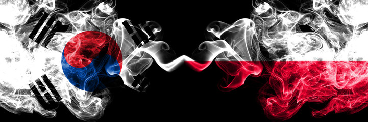 South Korea vs Poland, Polish smoky mystic flags placed side by side. Thick colored silky abstract smoke flags of South Korean and Poland, Polish