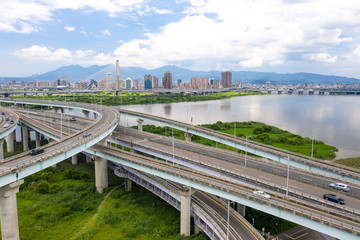 Fototapeta premium Traffic Aerial View - Traffic concept image, birds eye daytime view use the drone in Taipei, Taiwan.