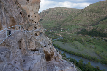 Caves in ancient rock-hewn town. Uplistsikhe is identified as one of the oldest urban settlements...