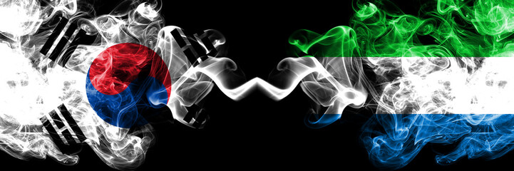South Korea vs Sierra Leone smoky mystic flags placed side by side. Thick colored silky abstract smoke flags of South Korean and Sierra Leone