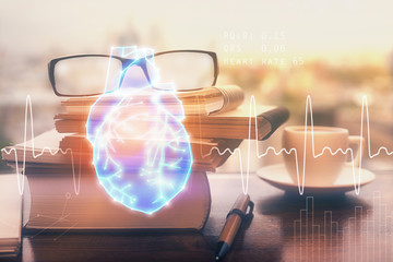 Heart drawing with glasses on the table background. Concept of medical education and healthcare....