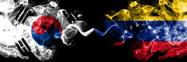 South Korea vs Venezuela, Venezuelan smoky mystic flags placed side by side. Thick colored silky abstract smoke flags of South Korean and Venezuela, Venezuelan