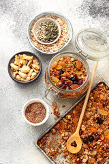 Fresh granola, muesli with pumpkin, nuts,cranberries and date honey.Copy space. Top view