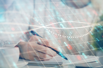 Forex chart displayed on woman's hand taking notes background. Concept of research. Multi exposure