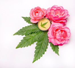 Cannabis infused beauty products with roses and marijuana leaves