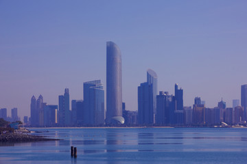 Fototapeta na wymiar Abu Dhabi skyscrapers city landscape view in blue colours, UAE