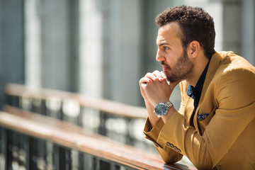 handsome young adult man in yellow suit