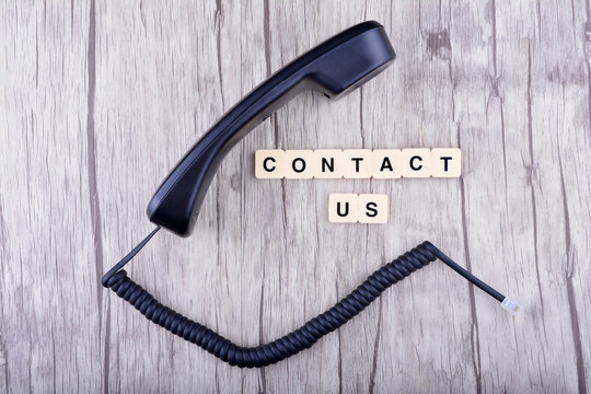 Contact Us Concept. Telephone with word "Contact US"