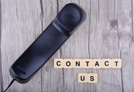 Contact Us Concept. Telephone with word "Contact US"