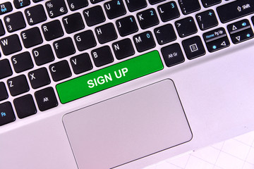 The computer keyboard button written word sign up