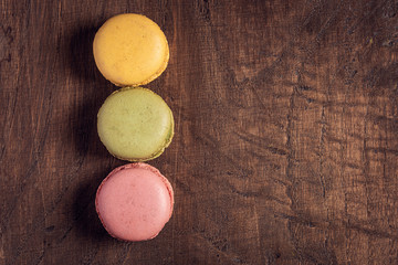 Macaroons on the wooden table