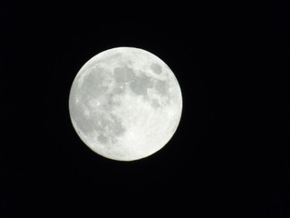 An amazing photography of the full moon over the city of Genova by night with a great clear sky in...
