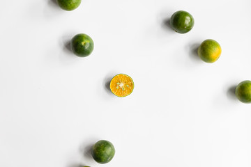 Top view, flat lay of fresh mandarin oranges on white background with copy space.