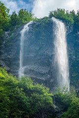 Obraz premium Views of the green mountains with the highest waterfall