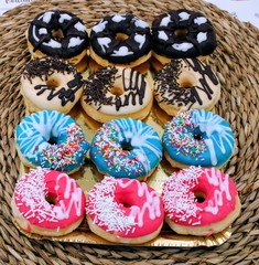 Delicious donuts with colorful chocolate