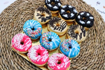 Delicious donuts with colorful chocolate