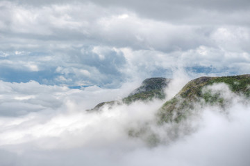 Two peaks percing, above the clouds, over the mountains, Charlevoix, QC, Canada