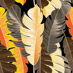 Seamless autumn pattern of tropical leaves of a palm tree