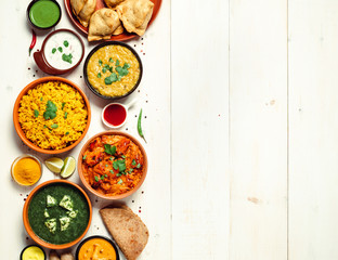 Indian cuisine dishes: tikka masala, dal, paneer, samosa, chapati, chutney, spices. Indian food on...