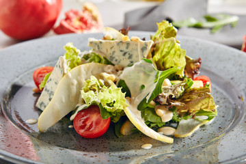 Salad with Sliced Pears, Gorgonzola Cheese, Greens and Pine Nuts