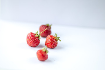 strawberries on a white sheet taken in the evening light from the window