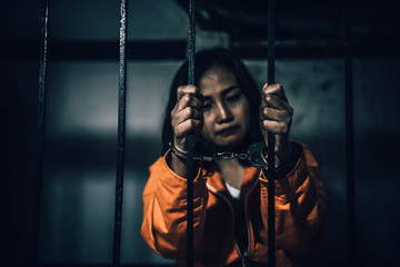 Portrait of women desperate to catch the iron prison,prisoner concept,thailand people,Hope to be...