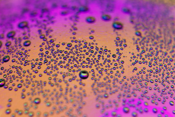 beautiful vials of air in water on a multi-colored background