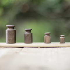 Weights on wood - blurry background