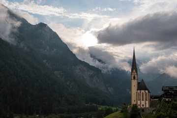 Fototapeta na wymiar A beautiful village Heiligenblut am Grossglockner surrounded by mountains in Austria