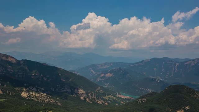 Timelapse of clouds forming over Baells reservoir and Pyrenees mountains near Berga, Barcelona, Spain
