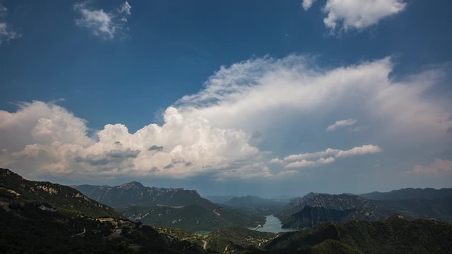 Timelapse of clouds forming over Baells reservoir and Pyrenees mountains near Berga, Barcelona, Spain
