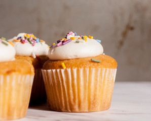 vanila cupcakes on granite surface