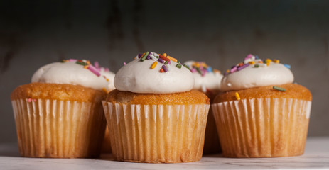 vanila cupcakes on granite surface