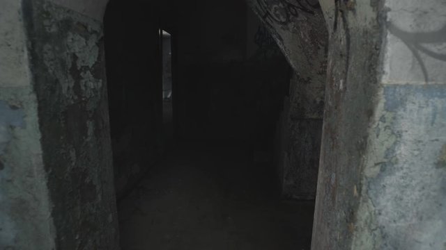 A ghost of a woman wanders the stairs of an old abandoned building.