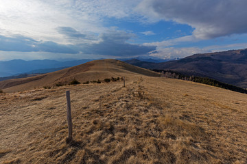 View from the Falò mount near the Mottarone mount, alps on the background, Piedmont, Italy.