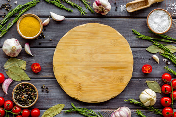 Chef work space with products and cutting board on wooden background top view mock up