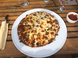 Alternative pizza with cheese and olives