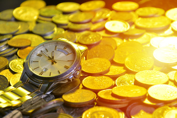 clock and stacks of coins : time - money