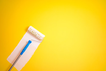 painter brush painting Wall from yellow to white