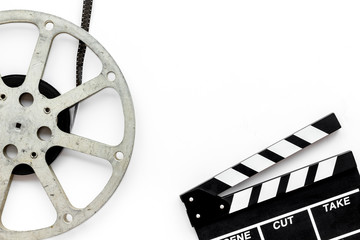 Watch film in cinema with video tape and clapperboard on white background top view