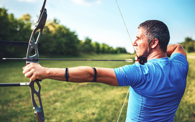 Archer. Sportsman practicing archery. Sport, recreation concept