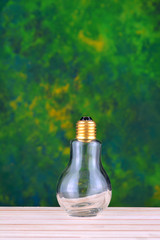 Bulb on green background